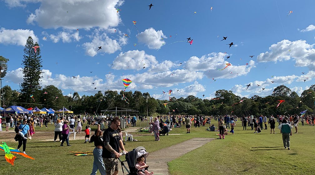 families enjoying kite flying at Brisbane Rotary Festival 